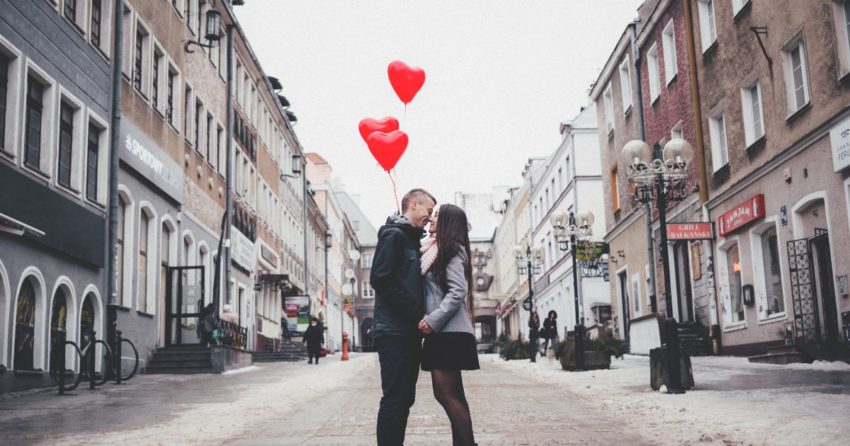 couple with heart balloons